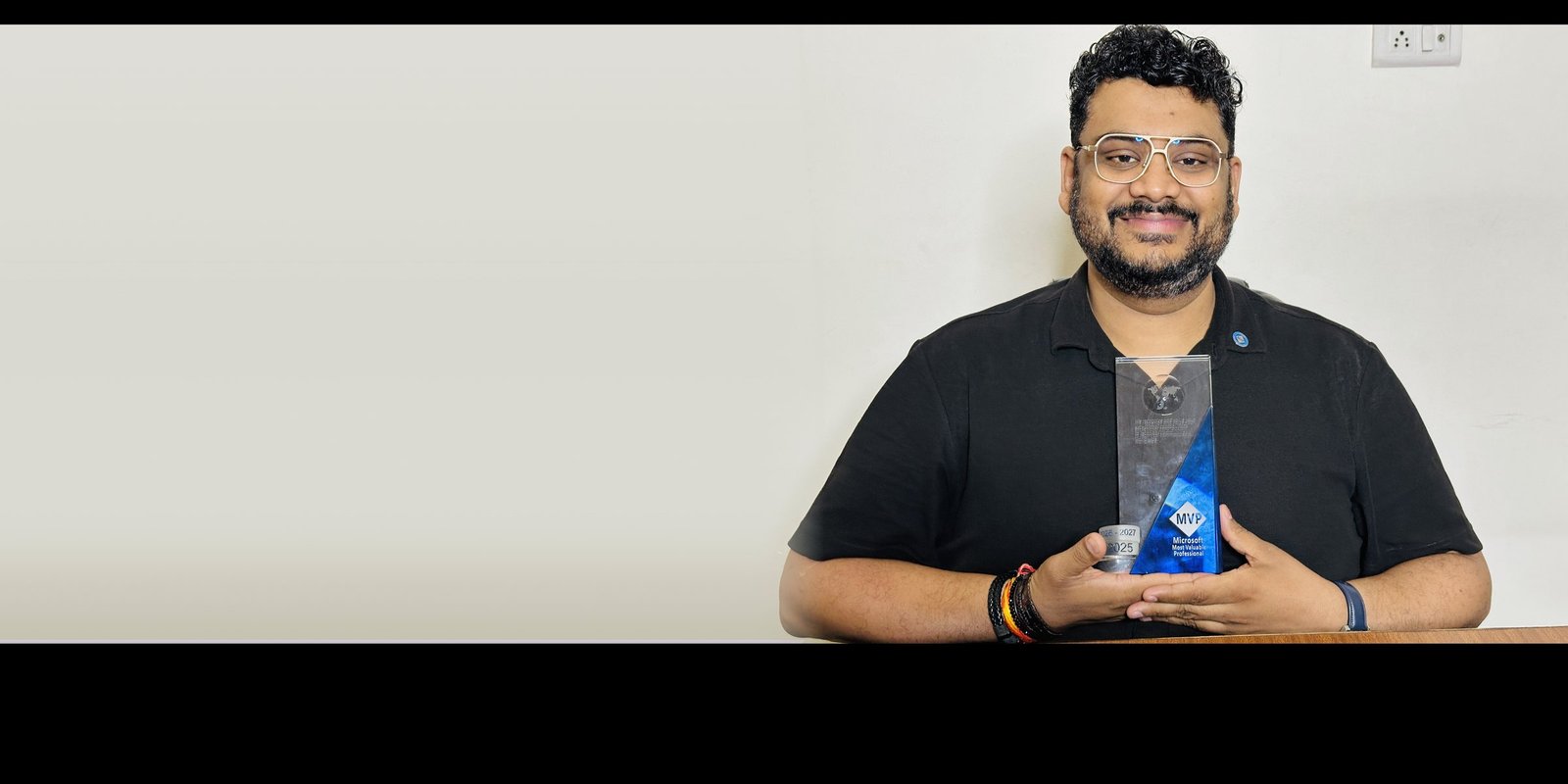Amit Bansal holding the Microsoft MVP award